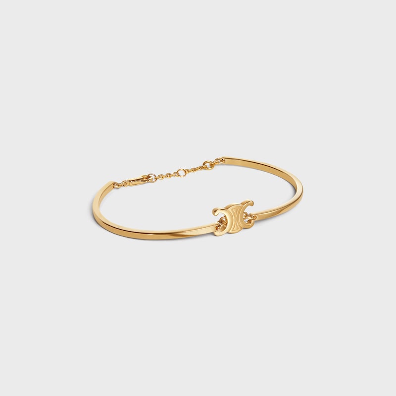 bracciale articolato triomphe in ottone con finitura oro