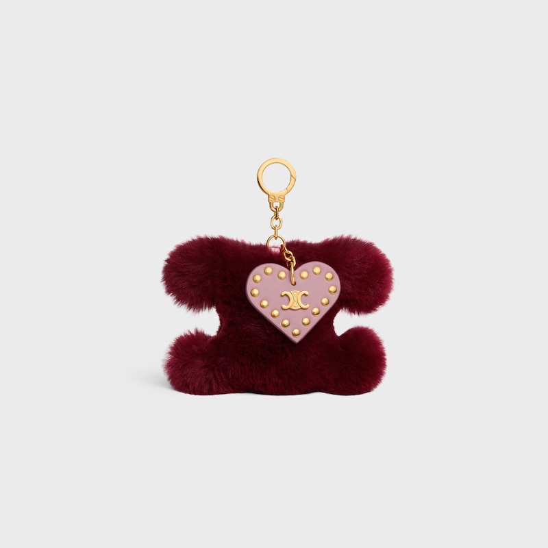 ciondolo pompon triomphe in shearling e pelle di vitello