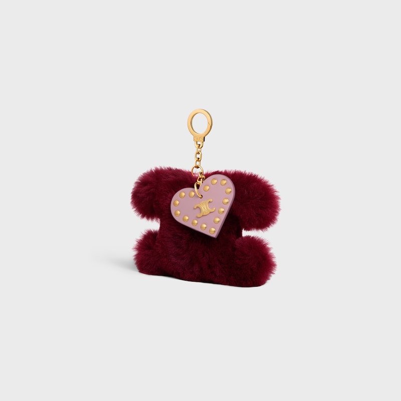 ciondolo pompon triomphe in shearling e pelle di vitello