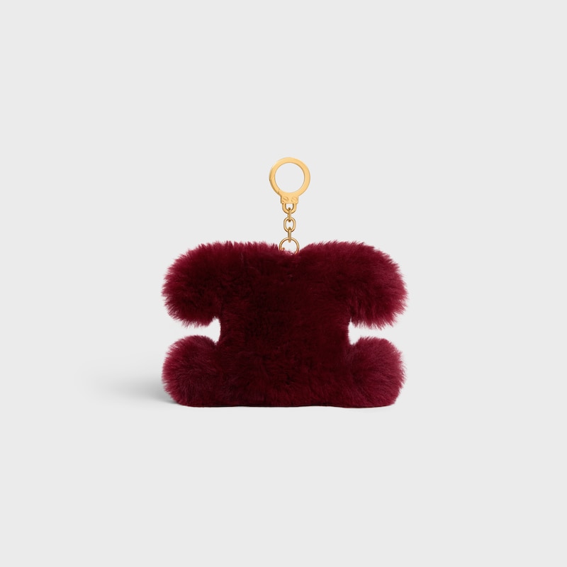 ciondolo pompon triomphe in shearling e pelle di vitello