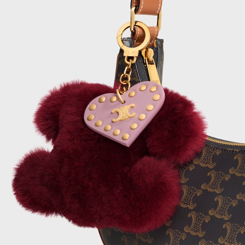 ciondolo pompon triomphe in shearling e pelle di vitello