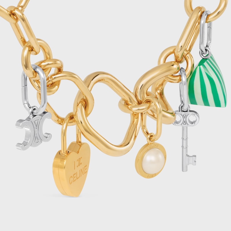 celine charms pearl in resina perlata e ottone con finitura oro
