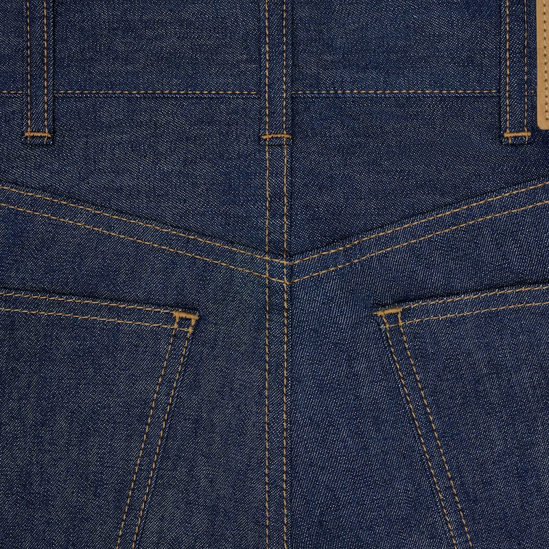 jeans da gattino in denim lavato grezzo