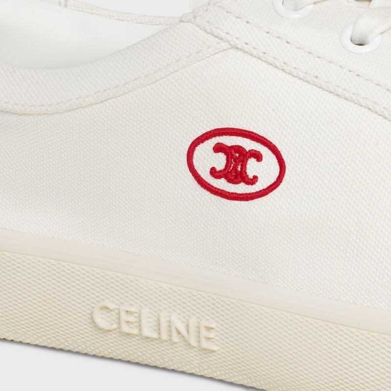 sneaker bassa celine lou con lacci e triomphe ricamato in tela e pelle di vitello